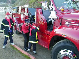 Henry rings the bell of the fire engine