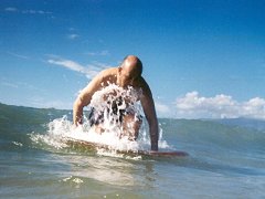 Andy tries to stand on his surf board