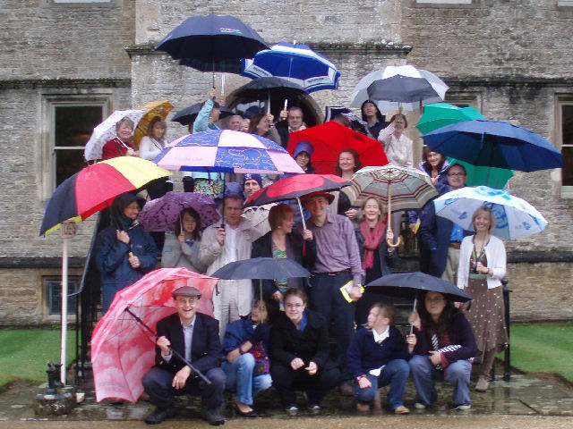 Brollies to the front! The group musters on the steps of Rousham house.