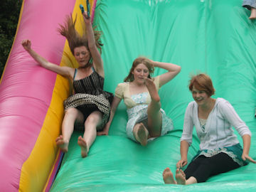 Big girls on the inflatable slide